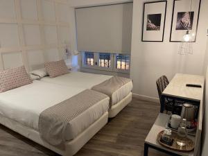 Łóżko lub łóżka w pokoju w obiekcie Hotel Boutique Teatro Romano