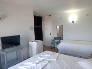 Ένα ή περισσότερα κρεβάτια σε δωμάτιο στο Hotel Turismar +22 φωτογραφίες
