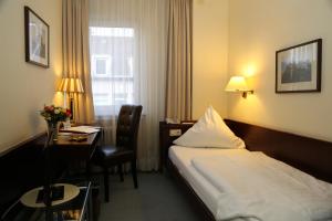 Säng eller sängar i ett rum på Hotel Löhndorf