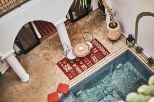 an overhead view of a swimming pool in a house at Riad Eldar in Marrakesh