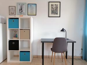 a desk with a chair and a book shelf at Apartment Layla - Intermezzo with sea view in center of Rabac in Rabac