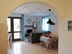 a living room with a table and a couch at Apartment Layla - Intermezzo with sea view in center of Rabac in Rabac