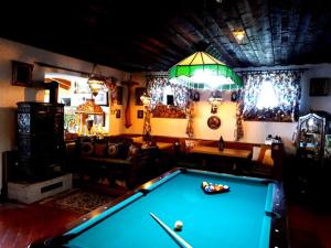 a billiard room with a pool table in a room at Landhaus Glashütt in Sankt Englmar