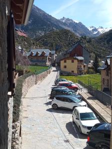 a group of cars parked in a parking lot at Apartamento Casa Leonora in Panticosa