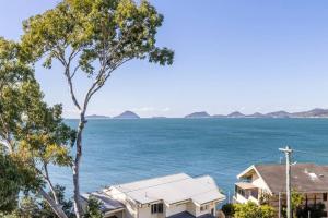 a view of the ocean from a house at Tranquil Escape - Koala Hotspot - 2 Bed 2 Bath Apt Spectacular Sea Views in Soldiers Point