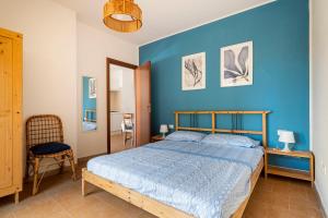 A bed or beds in a room at Casa Vacanze Albarìa