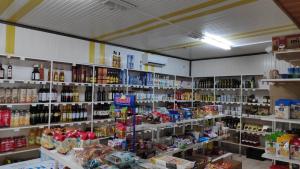 a store filled with lots of bottles of alcohol at Camping Mitikas and Bungalows in Plaka Litochorou