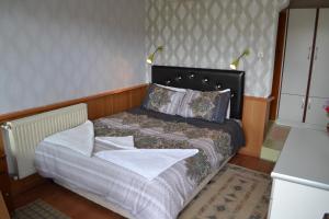 Кровать или кровати в номере Aspawa Hotel