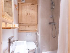 a bathroom with a toilet and a sink and a shower at Appartement Val-d'Isère, 3 pièces, 6 personnes - FR-1-694-112 in Val-d'Isère