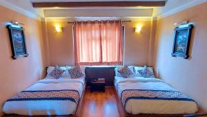 Postel nebo postele na pokoji v ubytování Hotel Garuda
