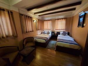 Postel nebo postele na pokoji v ubytování Hotel Garuda
