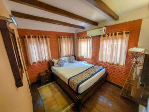 Postel nebo postele na pokoji v ubytování Hotel Garuda