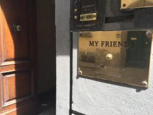 a sign on a building that says my friends ground floor reference at My Friends in Florence