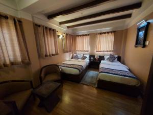 Postel nebo postele na pokoji v ubytování Hotel Garuda