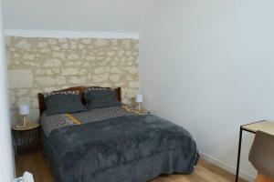 Posteľ alebo postele v izbe v ubytovaní La Grange de l'Olive