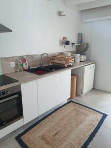 Kuchyňa alebo kuchynka v ubytovaní Appartement duplex 4 personnes
