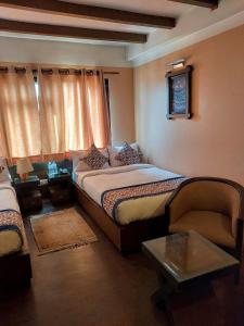 Postel nebo postele na pokoji v ubytování Hotel Garuda