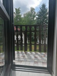 a sliding glass door looking out onto a patio at Vadása Nyaraló in Hegyhátszentjakab