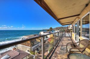 a balcony with a view of the ocean at Villa Roma at the Retreat in Laguna Beach in Laguna Beach