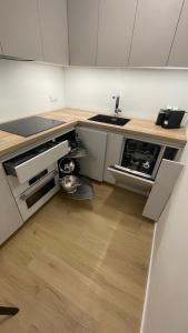 a kitchen with a sink and a counter at APARTAMENT 4 bed 2 room WARSAW in Warsaw