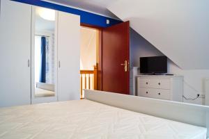 Postel nebo postele na pokoji v ubytování Boróka Apartman Lenti