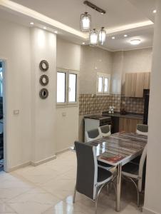 a kitchen and dining room with a table and chairs at Hurghada's Marina view in Hurghada