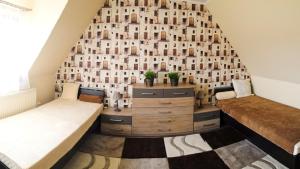 Postel nebo postele na pokoji v ubytování Boróka Apartman Lenti