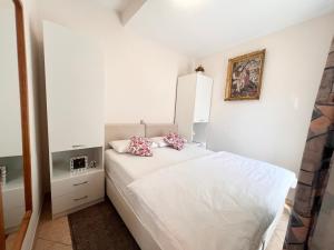 Postel nebo postele na pokoji v ubytování Apartments Tereza