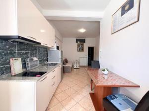 Kuchyň nebo kuchyňský kout v ubytování Apartments Tereza