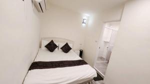 Letto o letti in una camera di Stay if you wish Homestay