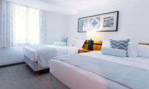 Voodi või voodid majutusasutuse Mahalo Diamond Beach Resort toas
