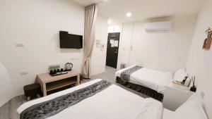Letto o letti in una camera di Stay if you wish Homestay