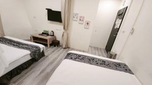 Letto o letti in una camera di Stay if you wish Homestay