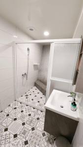 a bathroom with a shower and a sink at Stay if you wish Homestay in Jiufen