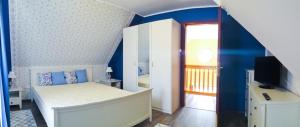 Postel nebo postele na pokoji v ubytování Boróka Apartman Lenti
