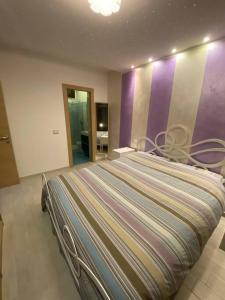 เตียงในห้องที่ Appartamento al mare - Porto Recanati