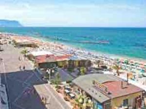 a view of a beach with a lot of people at Appartamento al mare - Porto Recanati in Porto Recanati