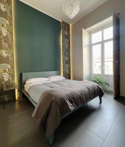 A bed or beds in a room at Catania Rooms