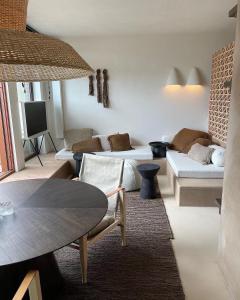 a living room with a couch and a table at Loft Living Parkview Suite in Nieuwpoort