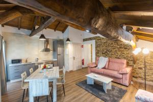 a living room with a couch and a table at Casona del Campo in Navia