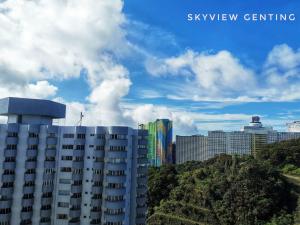 a tall building in front of a city at 5-6 PAX Family Room Skyview Golden Hills, Genting Highlands in Genting Highlands