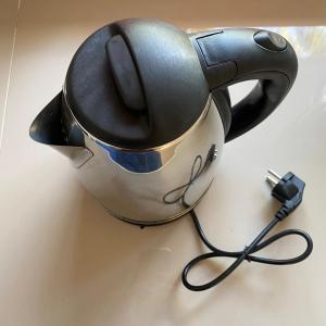 a tea kettle with a cord plugged into it at The An Ant บ้านพัก&โฮมสเตย์ in Sam Roi Yot