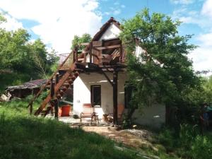 a small house with a staircase leading up to it at Scheunenloft- Hideaway - Ruheoase -Pool in Pirching am Traubenberg