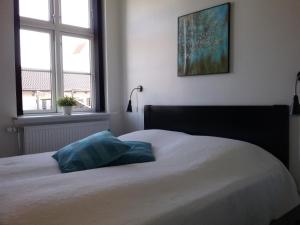 Postel nebo postele na pokoji v ubytování Hals Hotel