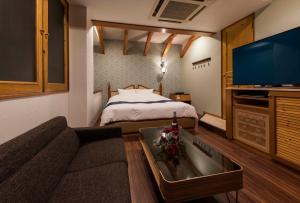 Postel nebo postele na pokoji v ubytování HOTEL ESTASI Adult only + 15 fotografií