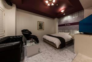Postel nebo postele na pokoji v ubytování HOTEL ESTASI Adult only