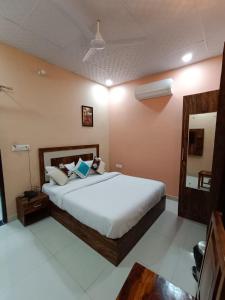 Ένα ή περισσότερα κρεβάτια σε δωμάτιο στο Hotel Greenoz
