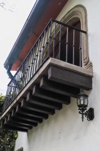 a staircase on the side of a building with a lamp at Gallery and Boutique BNB in San Angel Inn in Mexico City