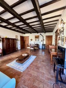 a living room with a couch and a table at La Casa del Castello in Montemerano