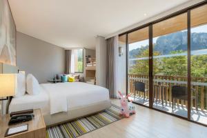 Кровать или кровати в номере Holiday Inn Resort Krabi Ao Nang Beach by IHG